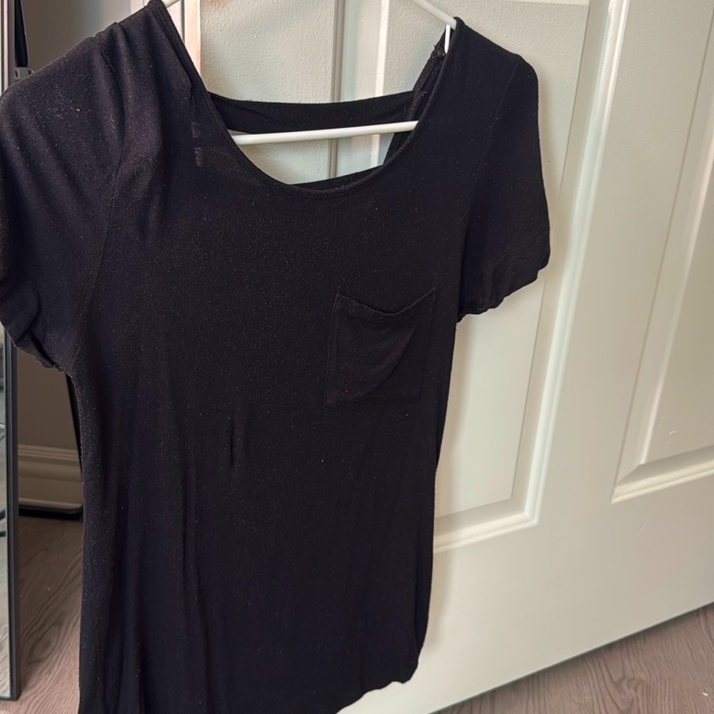 Zenana Outfitters. Size Small. Back top with pocket, open back, buttons sleeve.